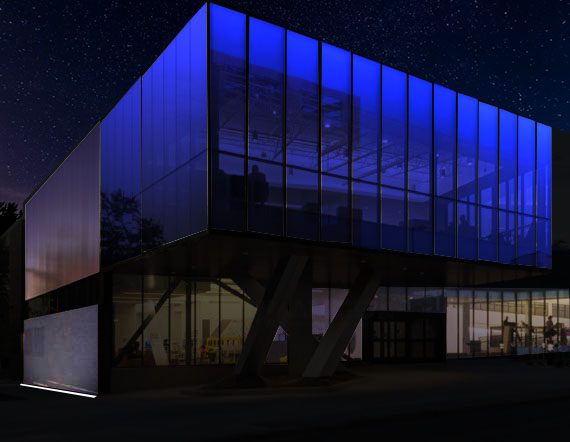 Glass facade lighting at night showing controlled exterior illumination and balanced interior brightness