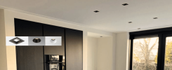 Modern kitchen with recessed lighting fixtures installed in the ceiling, featuring various recessed lighting designs. Stetra Lighting logo displayed at the bottom left